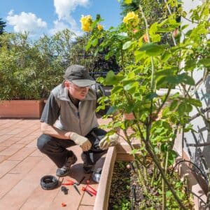 Worker doing a Sprinkler Irrigation System Installation & Repair