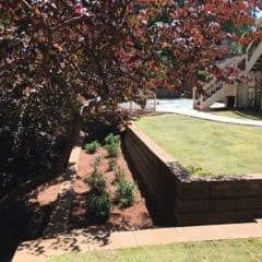 retaining wall with steps and a raised lawn